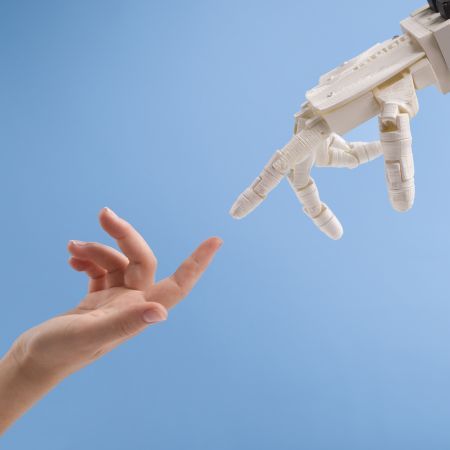 female-and-robot-hands-reaching-to-each-other-on-b-6289XC_20200401-204118_1